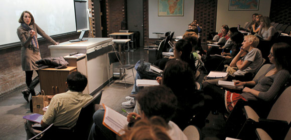 Kathy Morrison shows students eight different varieties of domesticated rice, or Oryza sativa.